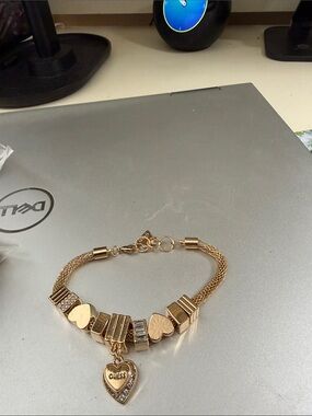 Gold color Guess mesh. Charm bracelet 8”.   NWOT.  Beautiful